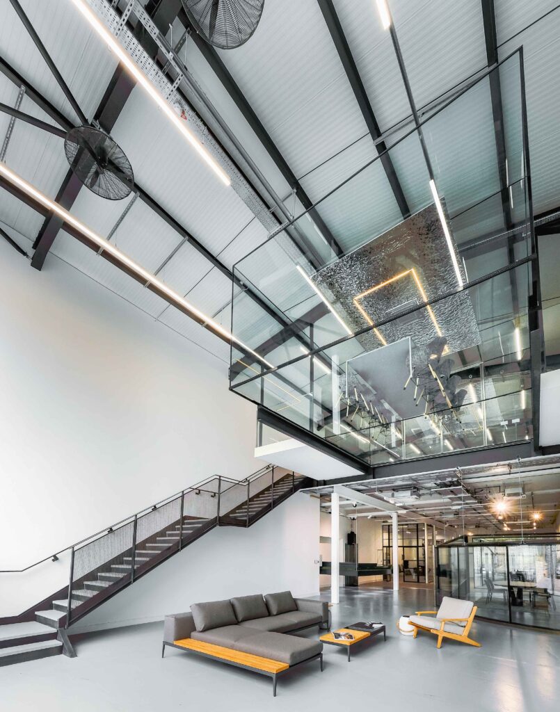 A big space with a glass ceiling and a staircase