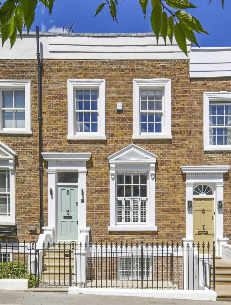 A brick building with white trim