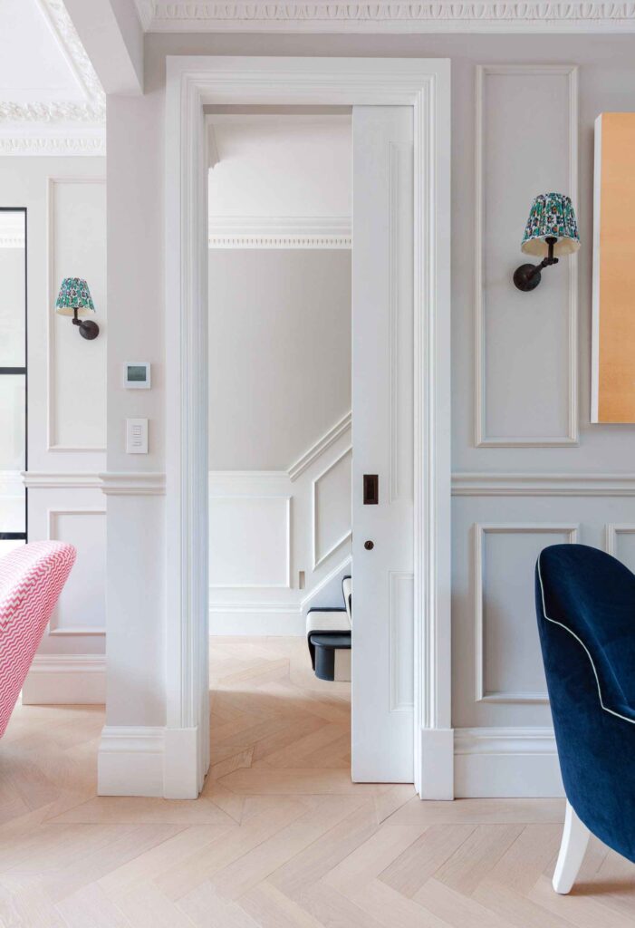 A white door opening to a room