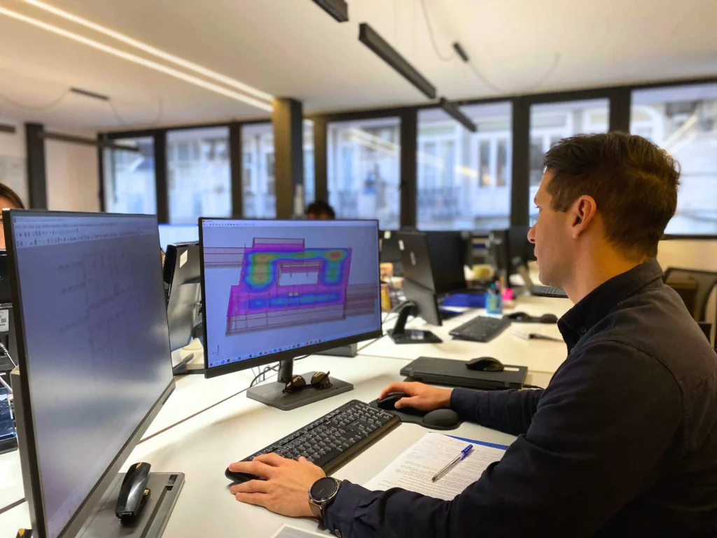 Structural engineer modelling a reinforced concrete structure on a computer